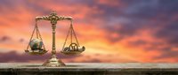 Golden scales of justice balancing Earth globe against industrial gears at dramatic sunset, symbolizing environmental law and sustainability concept.