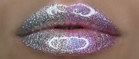 Closeup of lips with shimmering glitter makeup in silver and pink tones, featuring sparkly cosmetic application for beauty and makeup artistry projects.