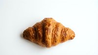 Golden croissant with flaky, buttery layers isolated on white background, ready for bakery, food, and culinary design projects.