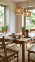 Modern dining room with wicker pendant lights over wooden table set with ceramic dishes and potted herbs on windowsill creating cozy natural atmosphere.