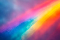 Vibrant rainbow colors in abstract blurred background with colorful gradient from blue to pink, orange and yellow for creative design projects.
