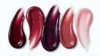 Colorful lipstick swatches in burgundy, pink and nude tones on white background for cosmetic beauty and makeup design applications.