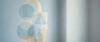 Geometric abstract composition with overlapping translucent circles and rectangles in soft blue and beige tones, ideal for modern design projects and contemporary backgrounds.