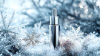 Luxury skincare serum bottle on winter frost background with snowflakes and sparkles. Premium cosmetic product photography for beauty and wellness advertising.