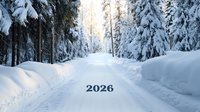 Snow covered forest road with 2026 text overlay against winter landscape background of tall evergreen trees laden with fresh snow during golden sunset light.