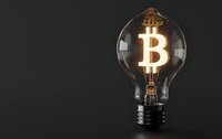 Glowing bitcoin symbol inside vintage light bulb on dark background, creative cryptocurrency concept for financial innovation and digital investment solutions.