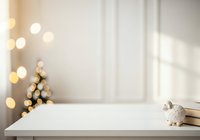 Wooden table with white wall background, warm bokeh lights, and decorative ornament, suitable for product display and holiday marketing.