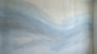 Soft abstract watercolor mural with flowing blue and gray wave shapes on a light background, evoking calm and serenity for interior decor.