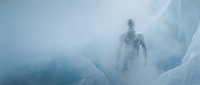 Ethereal figure emerging from dense fog and ice formations in a frozen landscape, evoking mystery and otherworldly atmosphere for fantasy, horror, and conceptual design projects.