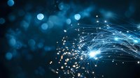 Abstract digital network with glowing blue light streams and bokeh effect on dark background, representing technology and connectivity in modern digital world.
