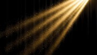 Golden light rays streaming through darkness with sparkling dust particles creating dramatic illumination effect on black background.