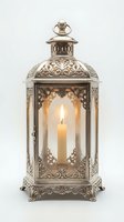 Ornate metal lantern with lit candle inside, featuring intricate filigree detailing and glass panels, ideal for home decor and lighting design projects.