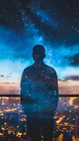 Silhouette of person against starry night sky and city lights, double exposure effect creating dreamy cosmic atmosphere over urban landscape at dusk.