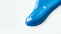 Blue glossy paint or gel smear dripping on white surface, vibrant liquid texture with shiny finish, close-up macro shot for creative backgrounds.