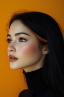 Profile portrait of young Asian woman with long dark hair against vibrant orange background, wearing black turtleneck and natural makeup.
