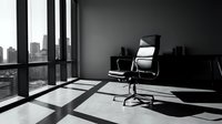 Modern office workspace with empty desk and ergonomic chair in minimalist high-rise interior, featuring floor-to-ceiling windows overlooking urban skyline and dramatic shadow patterns.