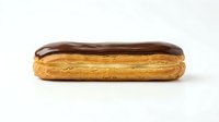 Chocolate-glazed eclair with golden pastry shell, isolated on white background, suitable for bakery, food, and culinary design projects.