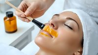 Young woman receiving professional facial treatment with vitamin C serum application at luxury spa salon, skincare and beauty procedure with orange cosmetic.