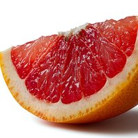 Fresh juicy grapefruit wedge showing vibrant red pulp segments and orange peel on white background, macro close up view for food and beverage marketing.