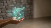 Hands holding glowing turquoise energy swirl with magical light effects against brick wall background for spiritual and mystical design concepts.