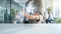 Business professional holding glowing star icon in modern office environment, representing success, achievement, and rating concept for corporate growth.