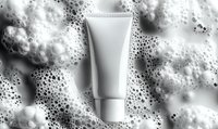 White cosmetic tube mockup floating in soap foam and bubbles on gray background, blank package template for skincare product branding and advertising.