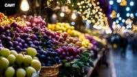 Fresh grapes and fruits at evening farmers market with festive bokeh lights and decorations creating magical holiday atmosphere for seasonal food shopping.
