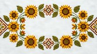 Cross-stitch embroidery pattern featuring sunflowers and decorative motifs in traditional folk art style on white fabric background for crafting projects.