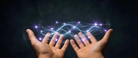 Two hands holding glowing digital network with connected nodes and light trails, representing data transfer, technology innovation, and global connectivity for business solutions.