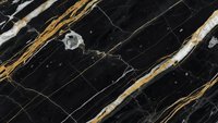 Luxurious black marble surface with elegant gold and white veining patterns creating sophisticated natural stone texture for premium interior design.