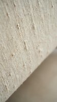 Natural beige linen fabric texture with organic cotton fibers and woven threads creating rustic textile background for interior design projects.