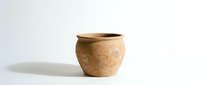 Handcrafted ceramic pot with natural earth tones and rustic texture, isolated on white background for home decor and pottery design projects.