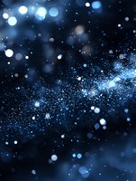 Magical blue glowing particles and bokeh lights scattered on dark background create dreamy cosmic atmosphere for festive designs and celebrations.