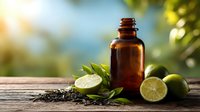 Amber essential oil bottle with fresh lime slices and herbs on wooden surface against blurred natural background for aromatherapy and wellness.