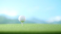 Golf ball on white tee against blurred green grass and blue sky background, minimalist composition with soft focus effect for sports and leisure designs.