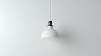 Minimalist white pendant lamp hanging against light gray wall, modern industrial design style lighting fixture with black cord and ceiling mount.