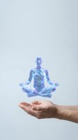 Holographic meditation figure floating above open palm representing mindfulness, spiritual wellness, and digital health technology concepts.
