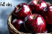 Fresh red apples in wicker basket on dark background, capturing autumn harvest mood for seasonal food photography.