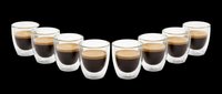 Set of eight double-wall glass espresso cups filled with coffee, isolated on transparent background, ready for cafe menus, stickers, print on demand, and T-shirt design.