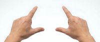 Two male hands pointing index fingers outward on white background, framing gesture for size or measurement concept, isolated.