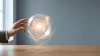 Hand holding glowing light bulb with energy waves on wooden desk, symbolizing innovation, creativity, and bright ideas for business solutions.