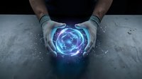 Hands holding glowing blue energy sphere with digital particles and light effects on concrete surface for futuristic technology concepts.