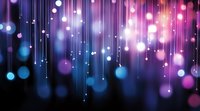Abstract purple and blue bokeh lights with vertical streaks creating magical atmosphere for digital backgrounds and creative projects.