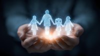 Glowing holographic family silhouette floating above cupped hands in dark background, representing protection, care and family unity. Spiritual light effect.