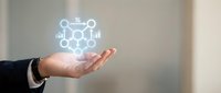 Young professional male hand holding glowing network molecule structure icon, representing molecular science, chemistry research, and interconnected data technology concepts for business innovation.