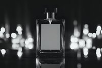 Elegant fragrance bottle with blank label against blurred bokeh lights background in monochrome style, reflecting luxury and sophistication in minimalist composition.