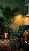 Cozy reading nook with emerald green velvet armchair, brass arc floor lamp casting warm light on potted palm plant, wooden side table with stacked books, and framed artwork on sage wall.