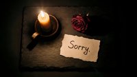 Burning candle, dried red rose, and handwritten sorry note on dark slate surface, evoking apology, regret, and emotional reconciliation.
