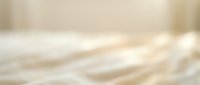 Abstract blurred beige and cream background with soft bokeh light effects for elegant design projects and presentations.