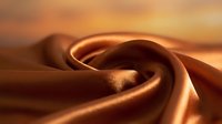 Smooth flowing bronze silk fabric with elegant curves and soft lighting creating luxurious textile waves for fashion and interior design projects.